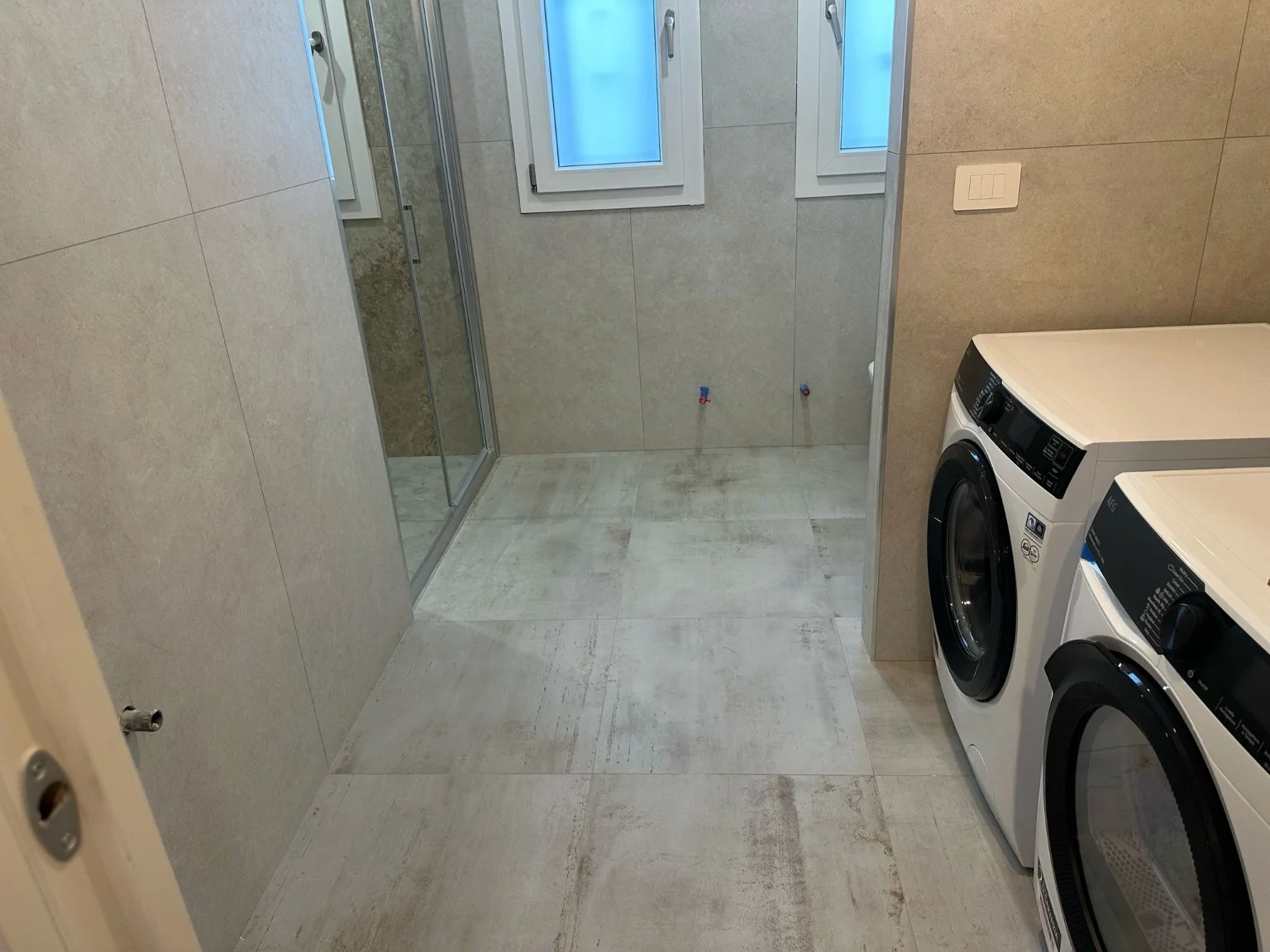 Funzione e finitura. Rivestimenti nella zona bagno e lavanderia.